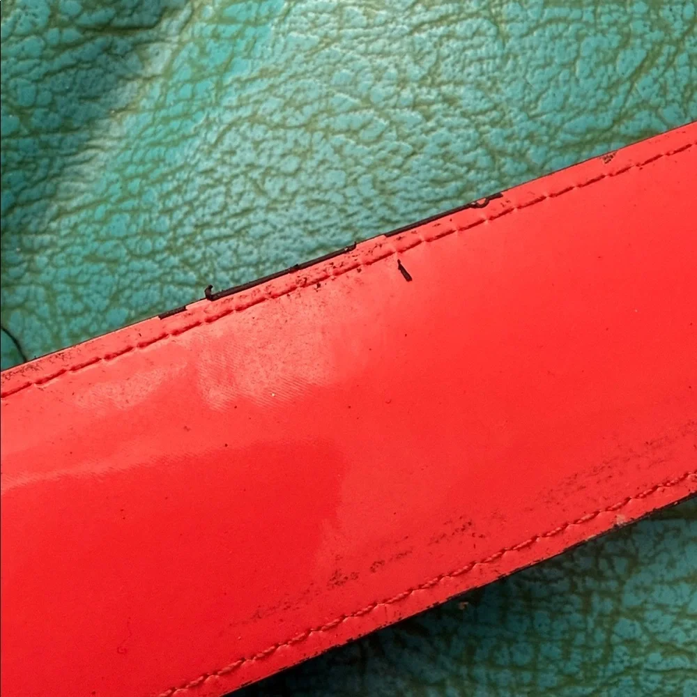 Reversible Michael Kors MK logo belt with bright shiny coral side - see flaw
